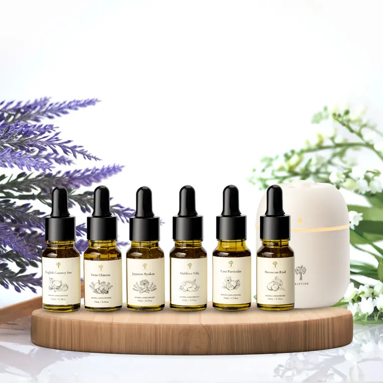 Six aroma concentrate bottles beside a mist diffuser