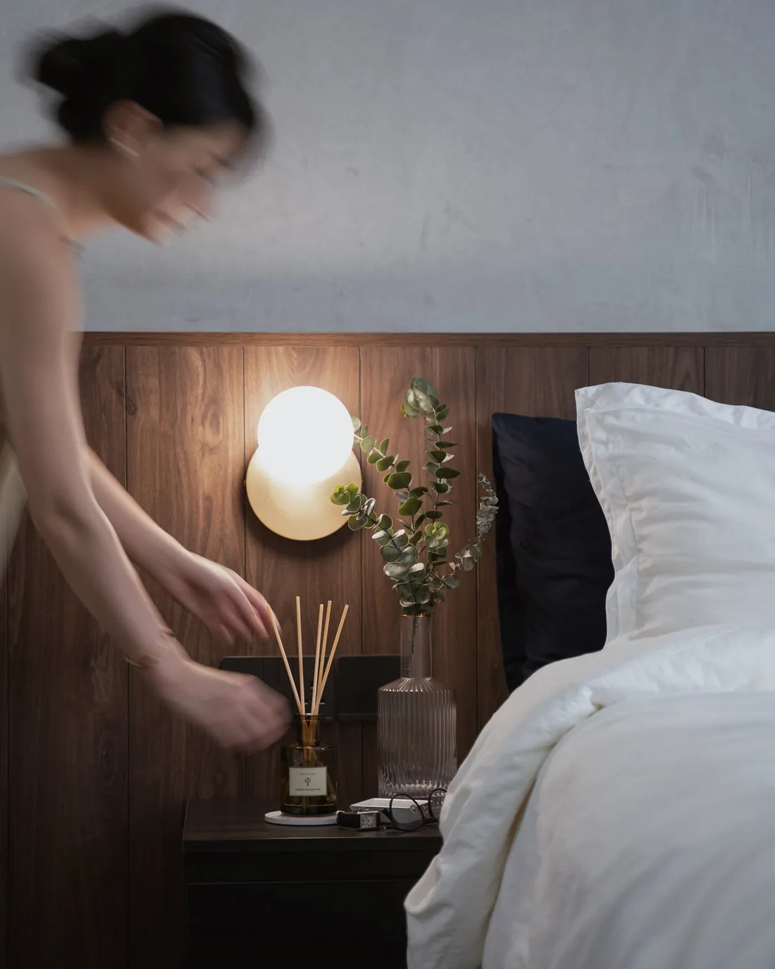 A Pristine reed diffuser on a bedside table